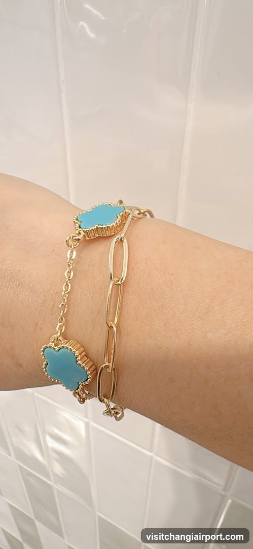 Gold and turquoise bracelet on wrist