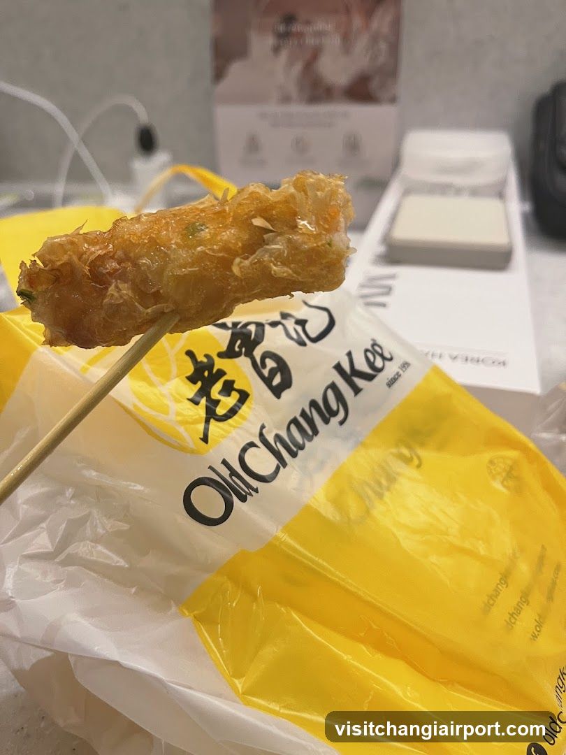 Fried food item on skewer with packaging