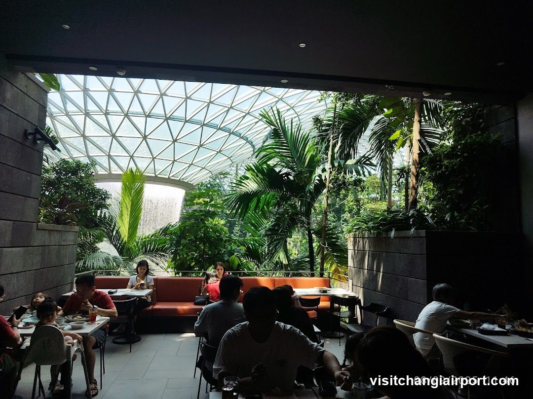 Indoor Dining Area with Tropical Garden View