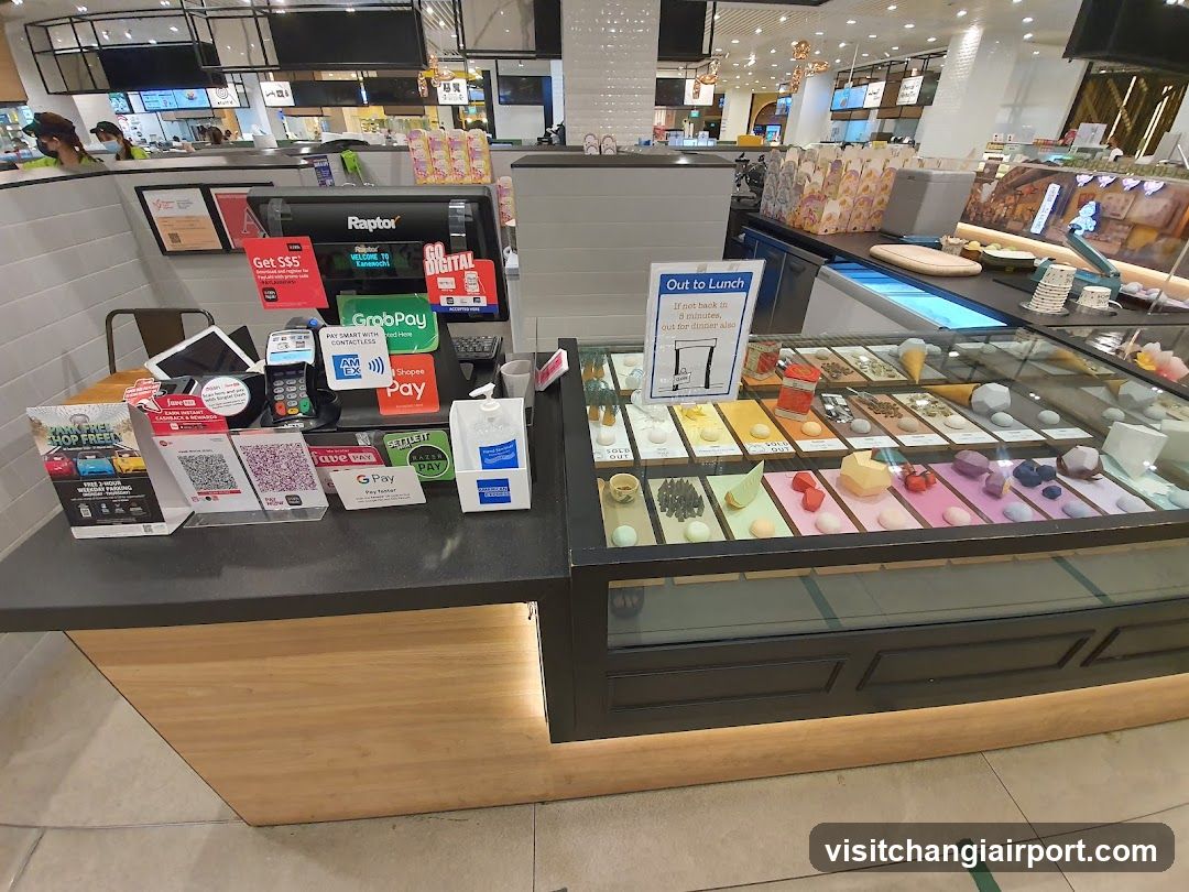 Food Counter with Payment Terminals and Dessert Display