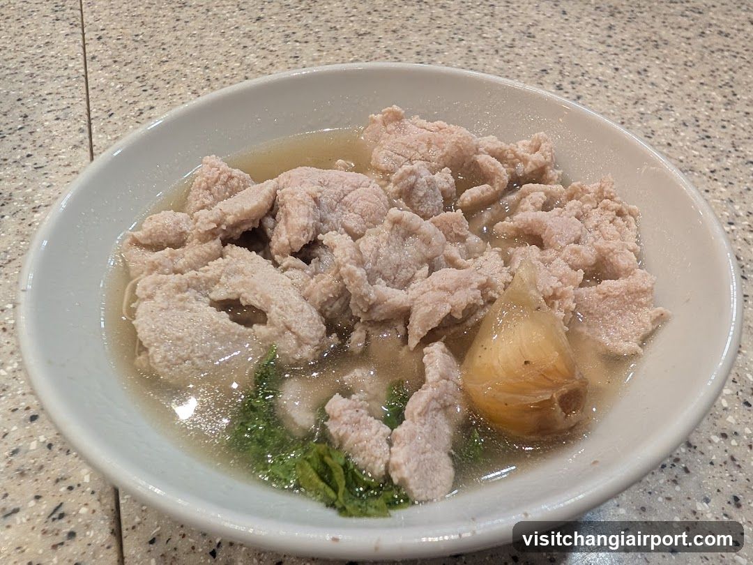 Bowl of Meat Soup with Garlic and Greens