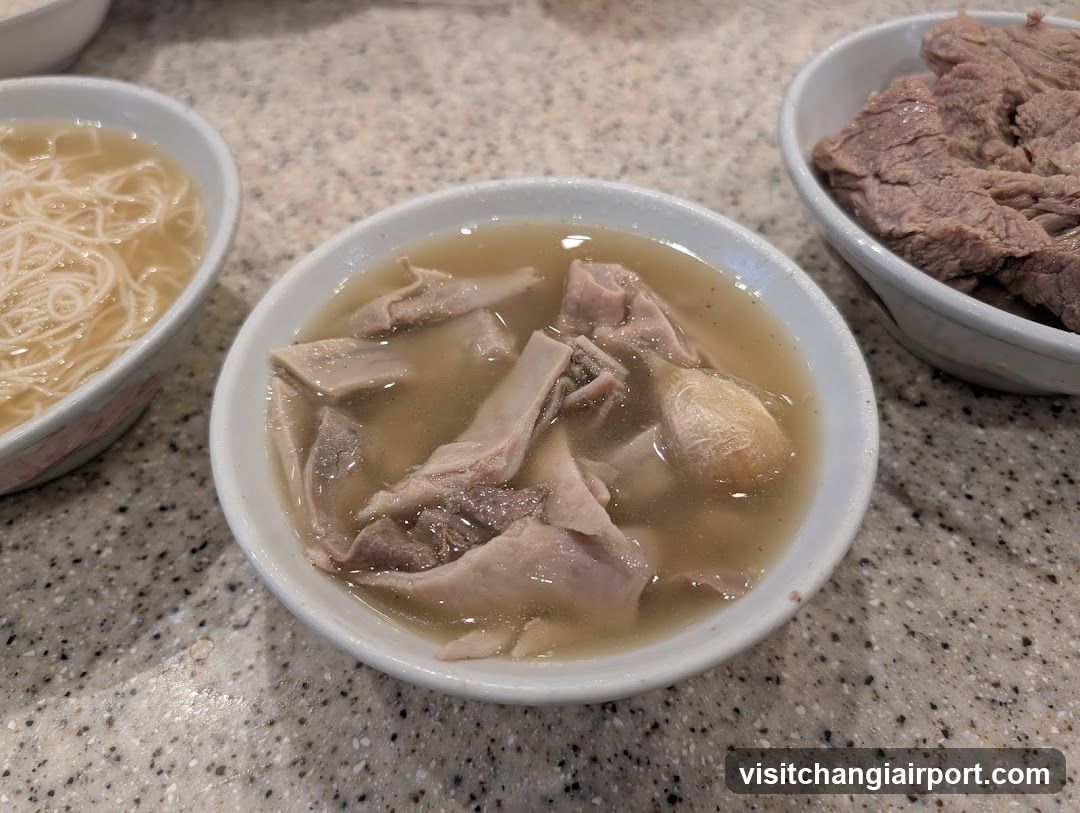 Bowl of Soup with Meat and Noodles