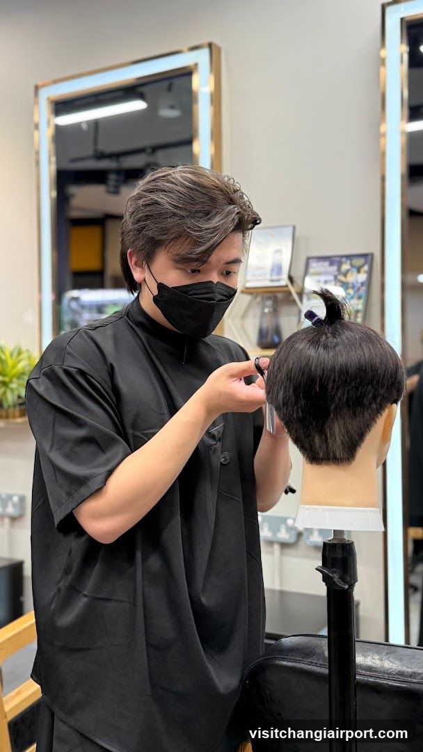 Hairdresser working on mannequin head