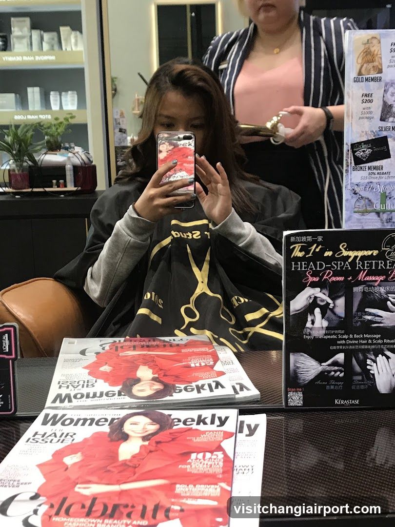 Hair Salon Interior with Magazines and Spa Ad