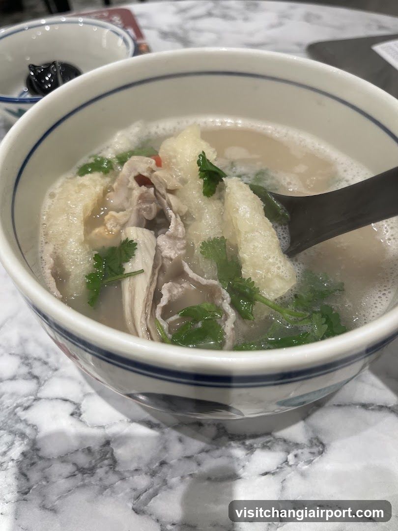 Bowl of Soup with Meat and Greens