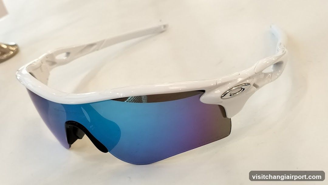 White Oakley Sunglasses with Blue Mirror Lens