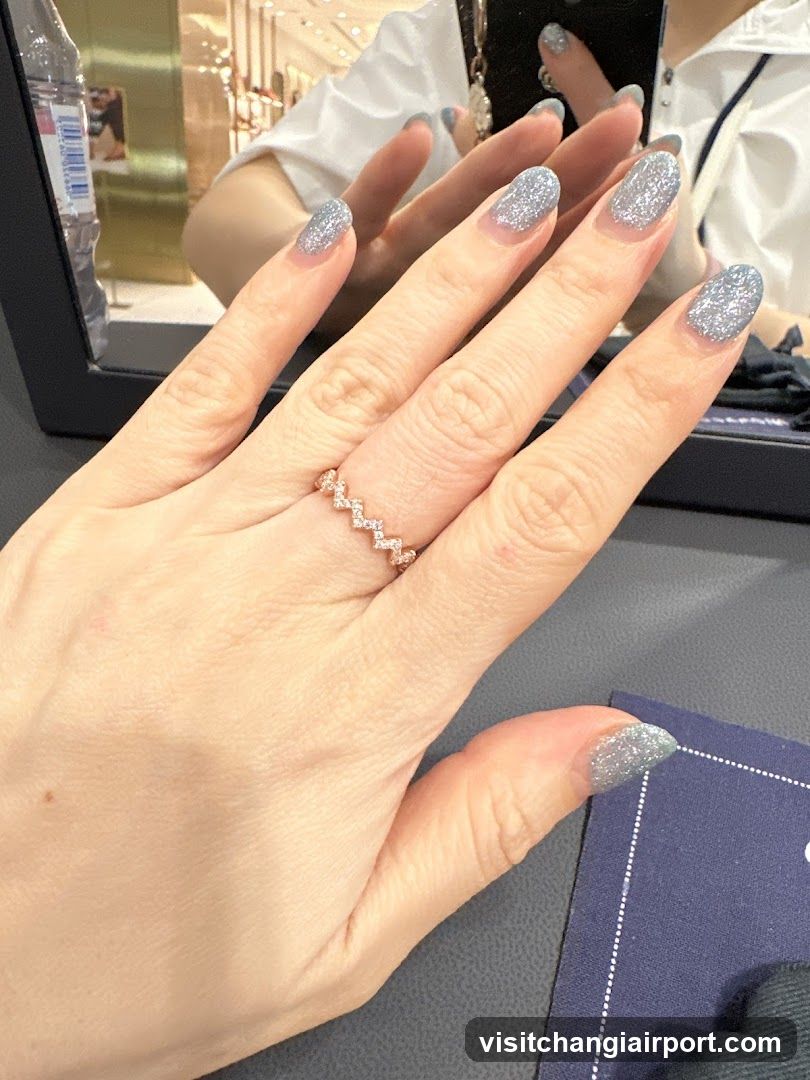 Hand with Glitter Nail Art and Ring