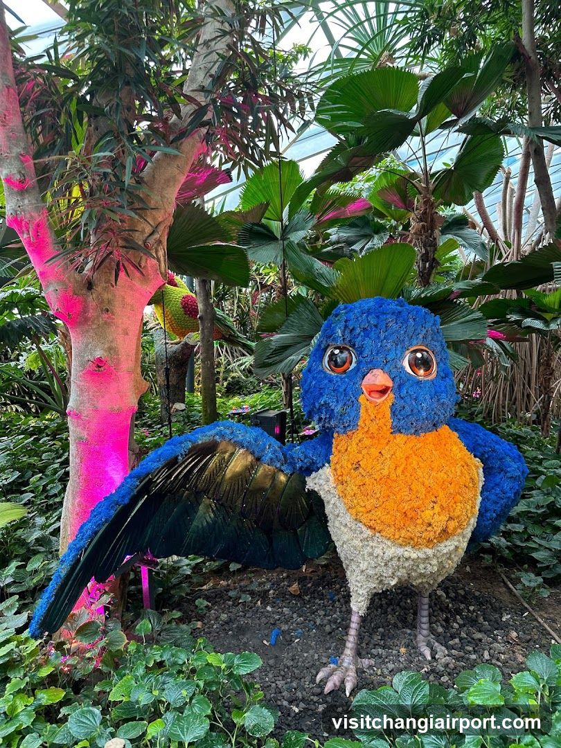 Floral Bird Sculpture in Garden Setting
