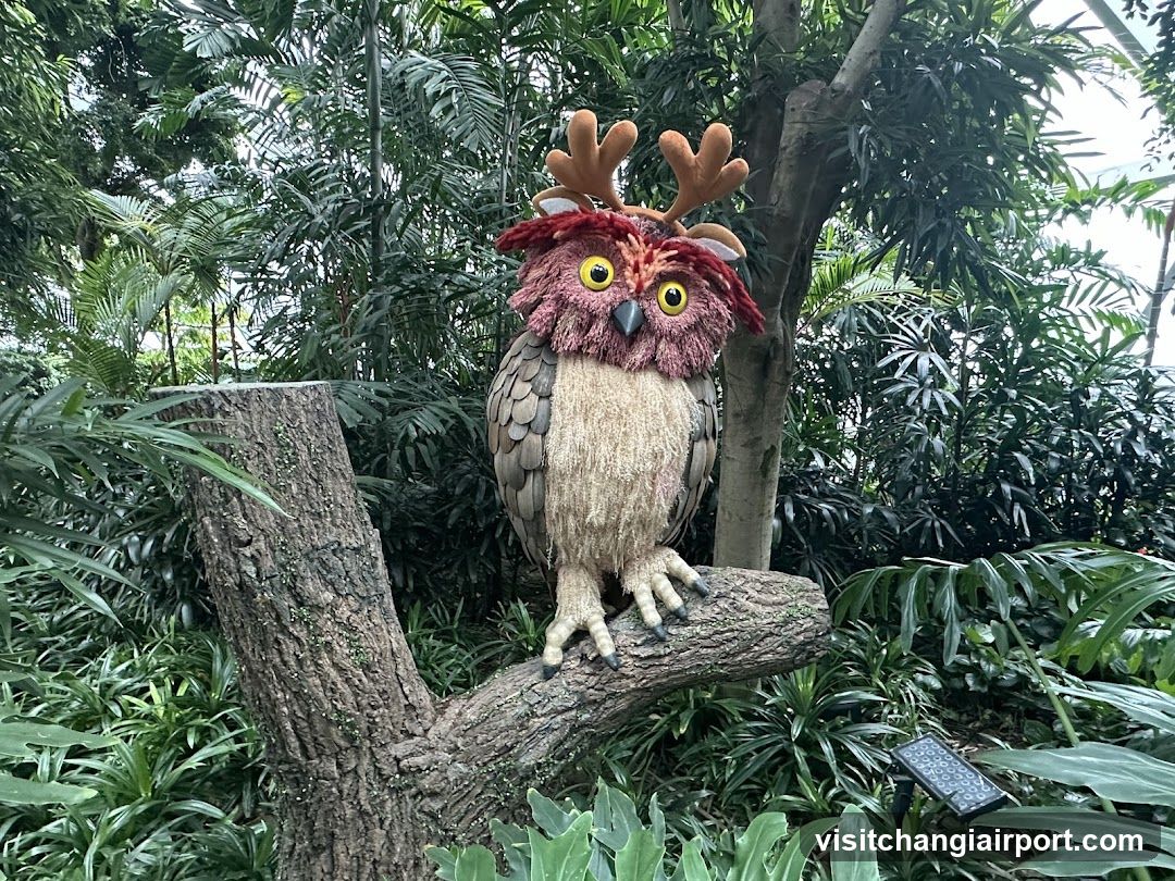 Owl Sculpture in Garden Setting