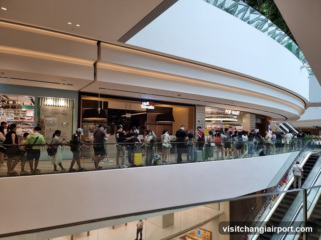 Crowded Mall Corridor with Storefronts