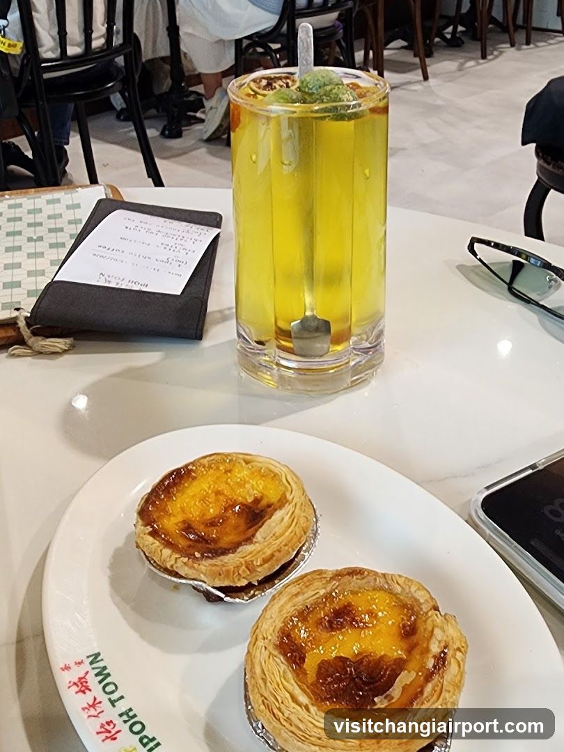 Egg Tart and Drink on Table