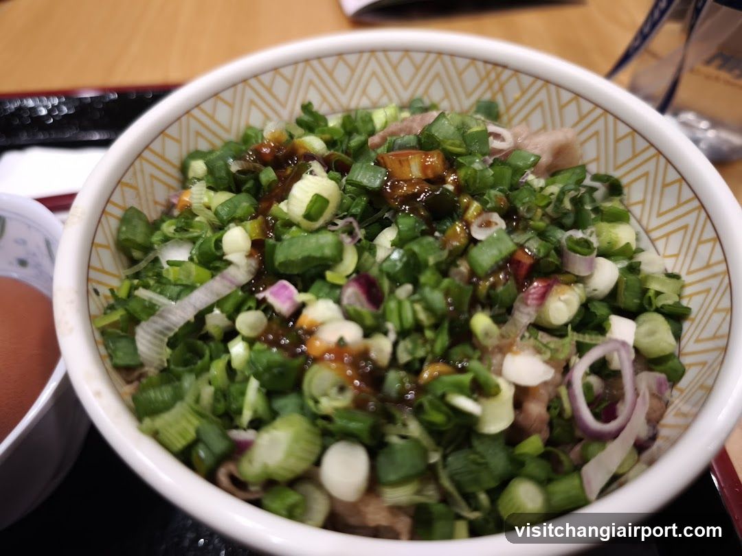 Bowl of Green Onion Topped Dish