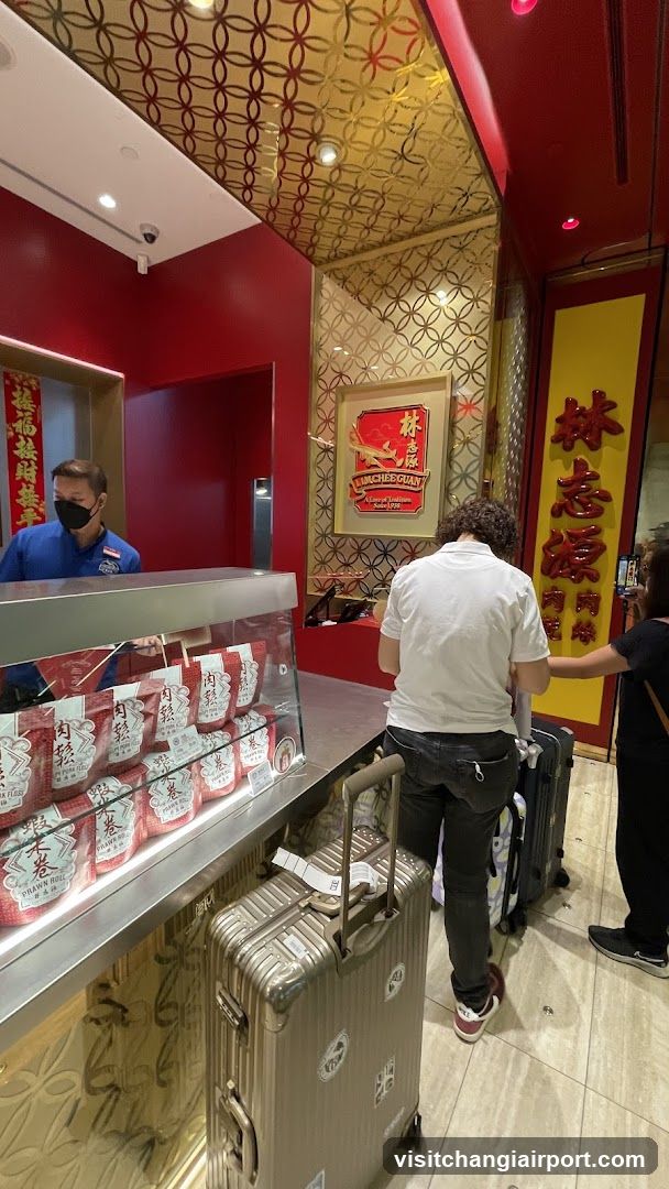 Interior of a Chinese-style shop with customers and staff