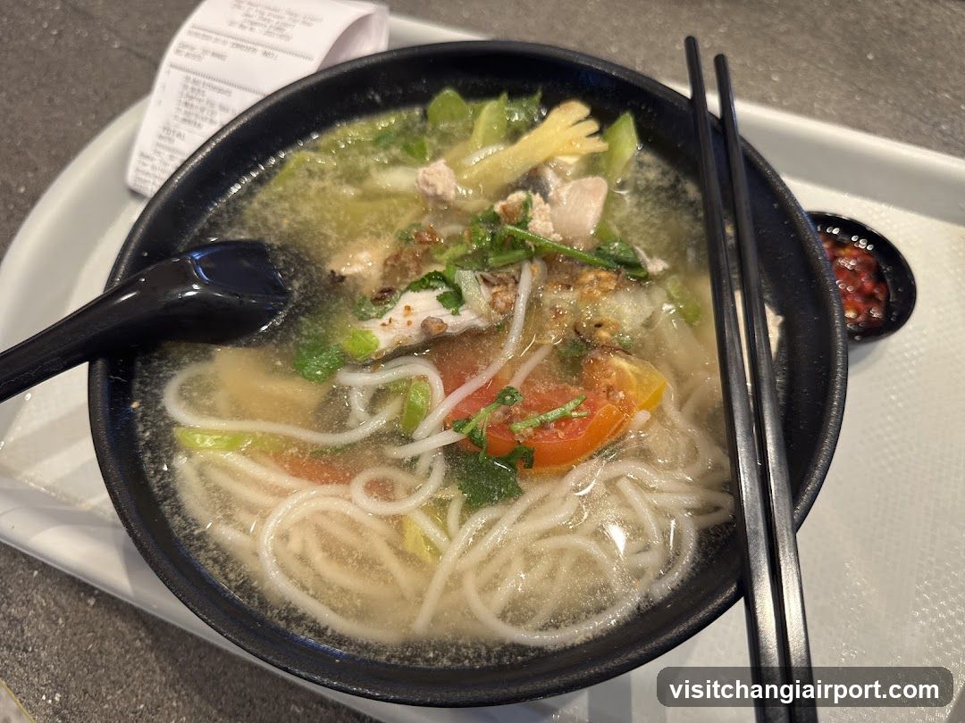 Bowl of Noodle Soup with Chopsticks and Spoon