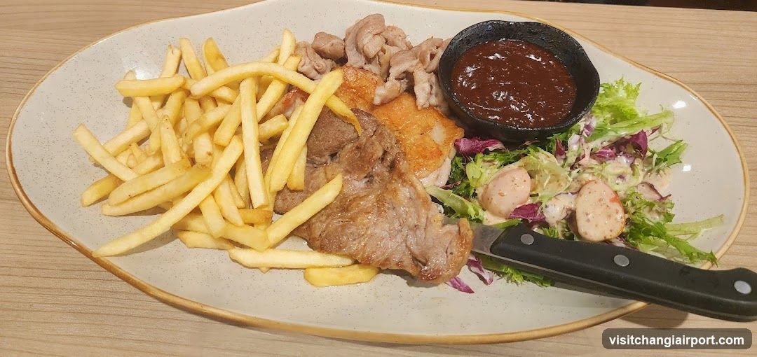 Plate of Food with Fries, Meat, Salad and Sauce