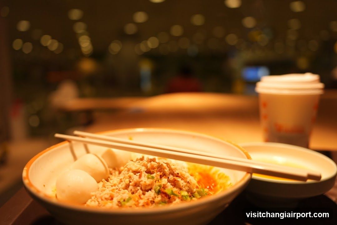 Food on a table with chopsticks and drink cup