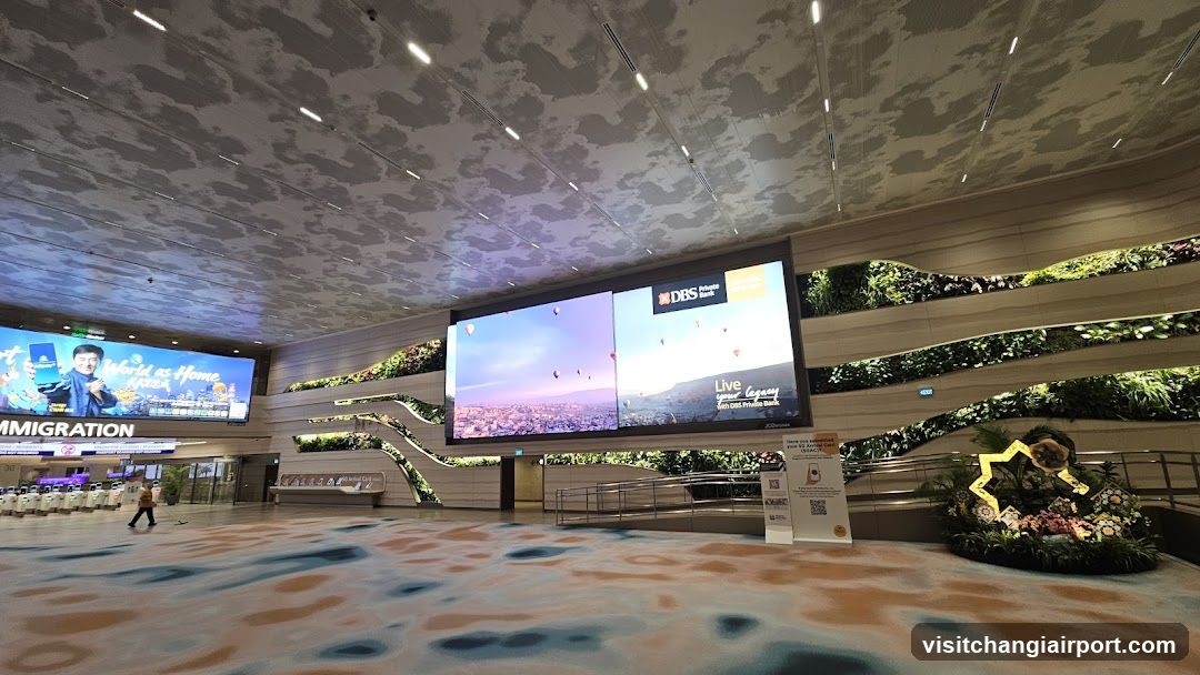 Airport Terminal Interior with Digital Screens and Greenery