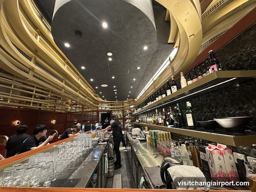 Bar Interior with Staff and Bottles