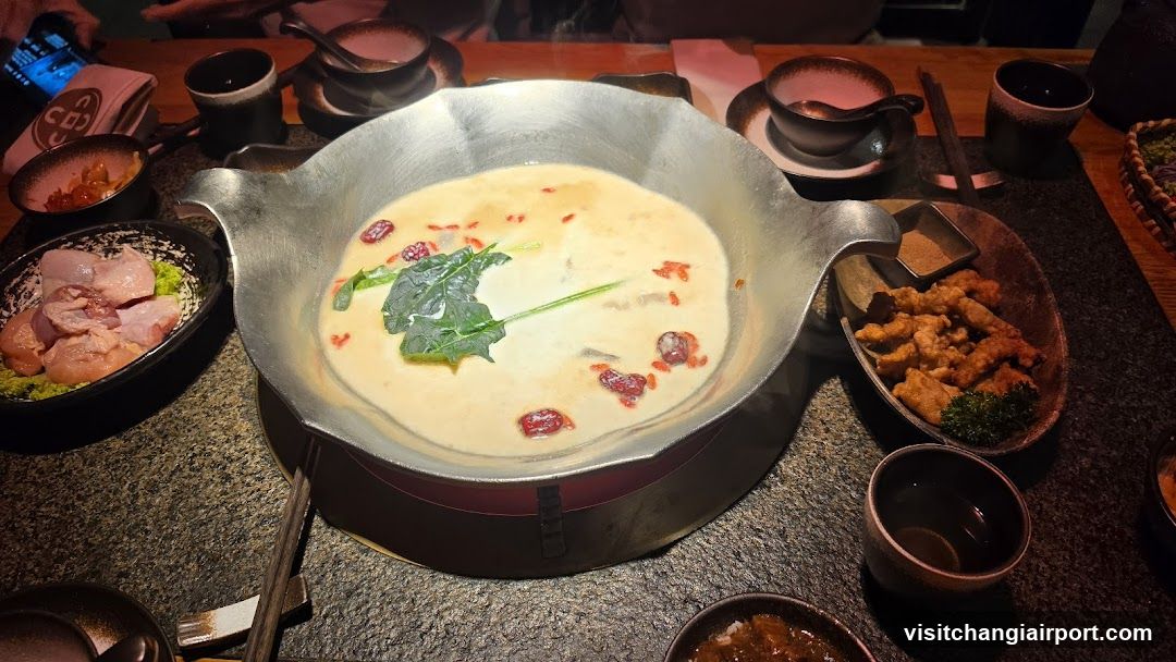 Dining Table with Hot Pot and Side Dishes