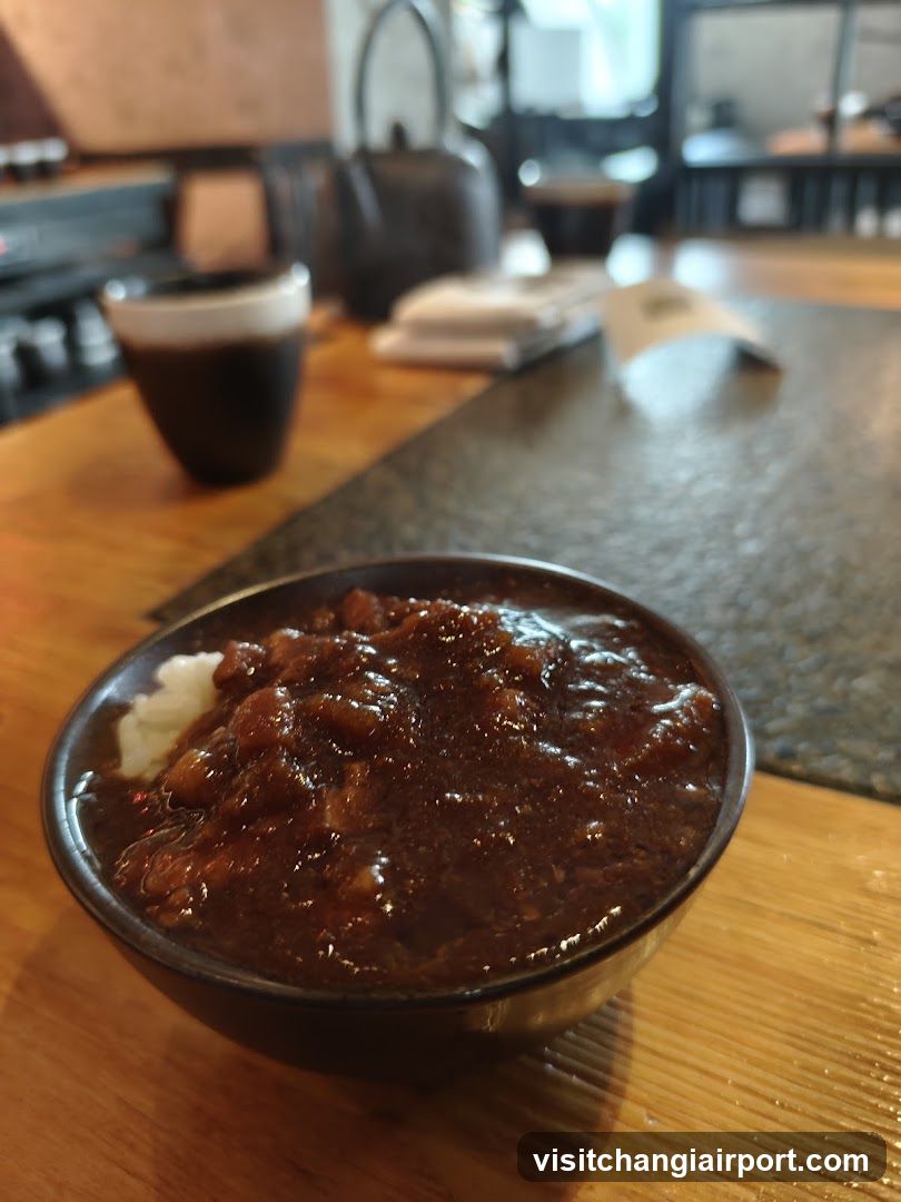 Bowl of stewed meat over rice