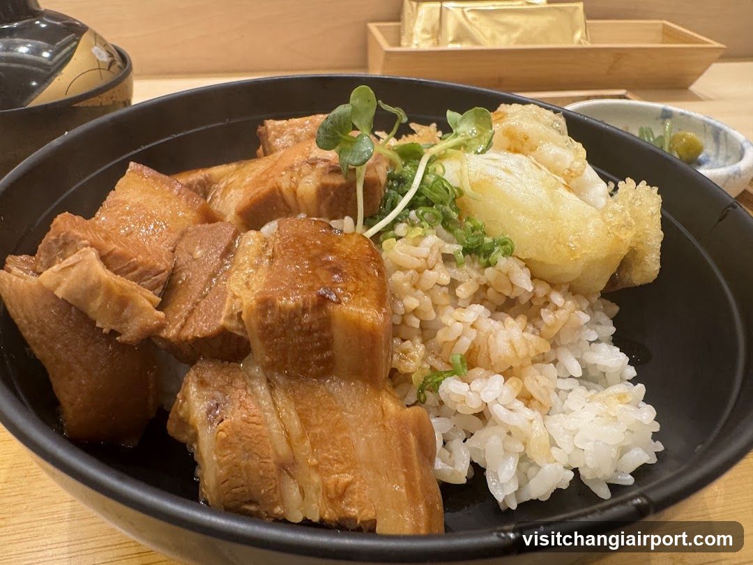 Japanese-style rice bowl with pork and vegetables