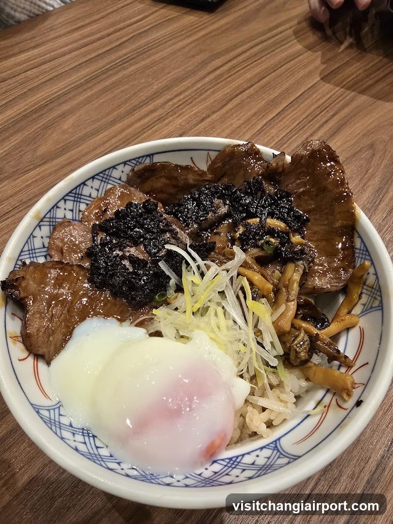 Bowl of Japanese-style rice dish with meat and egg