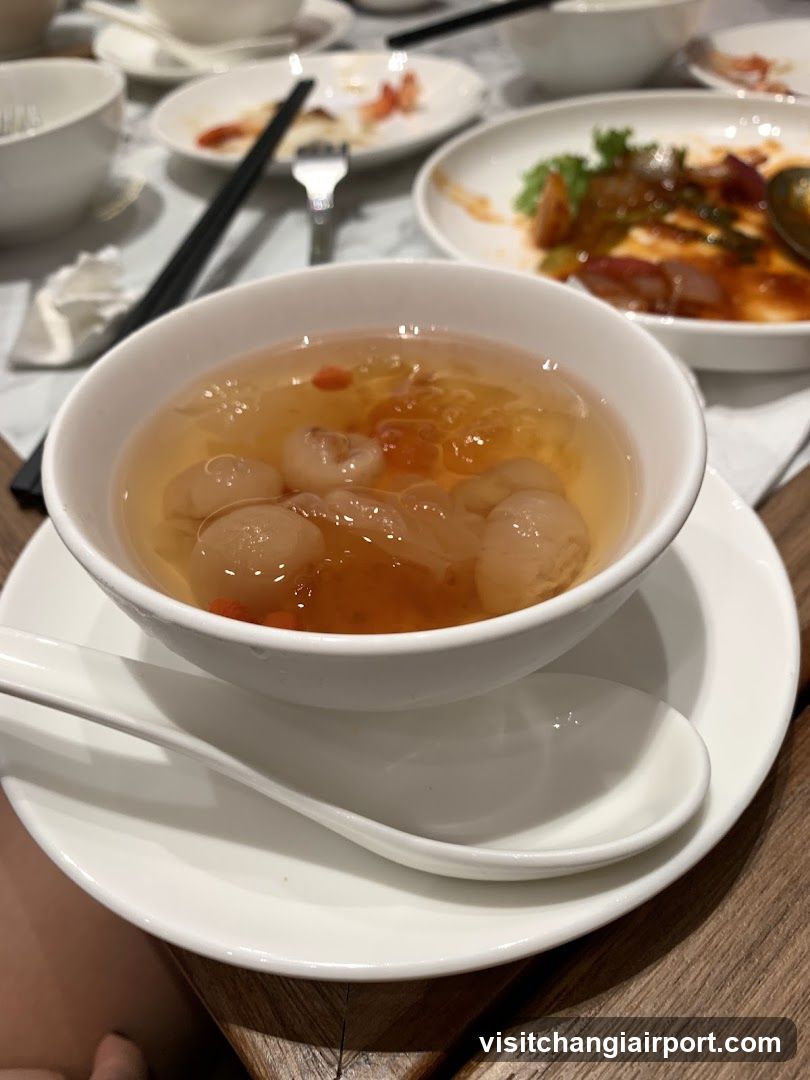 Dish with clear soup and round ingredients