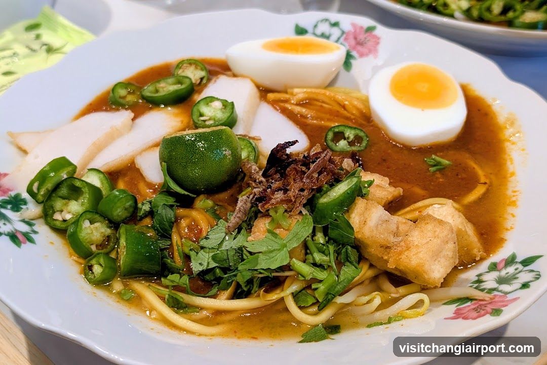 Spicy Noodle Bowl with Halved Eggs and Peppers