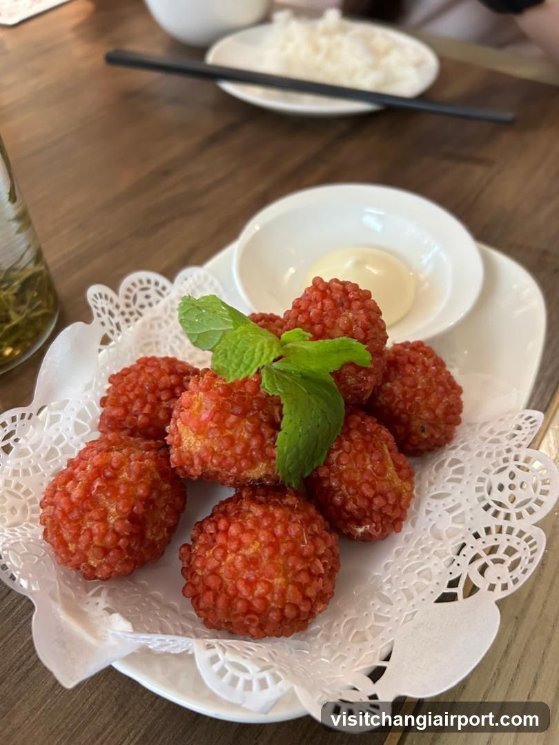 Red Baked Fruit Balls with Mint Garnish