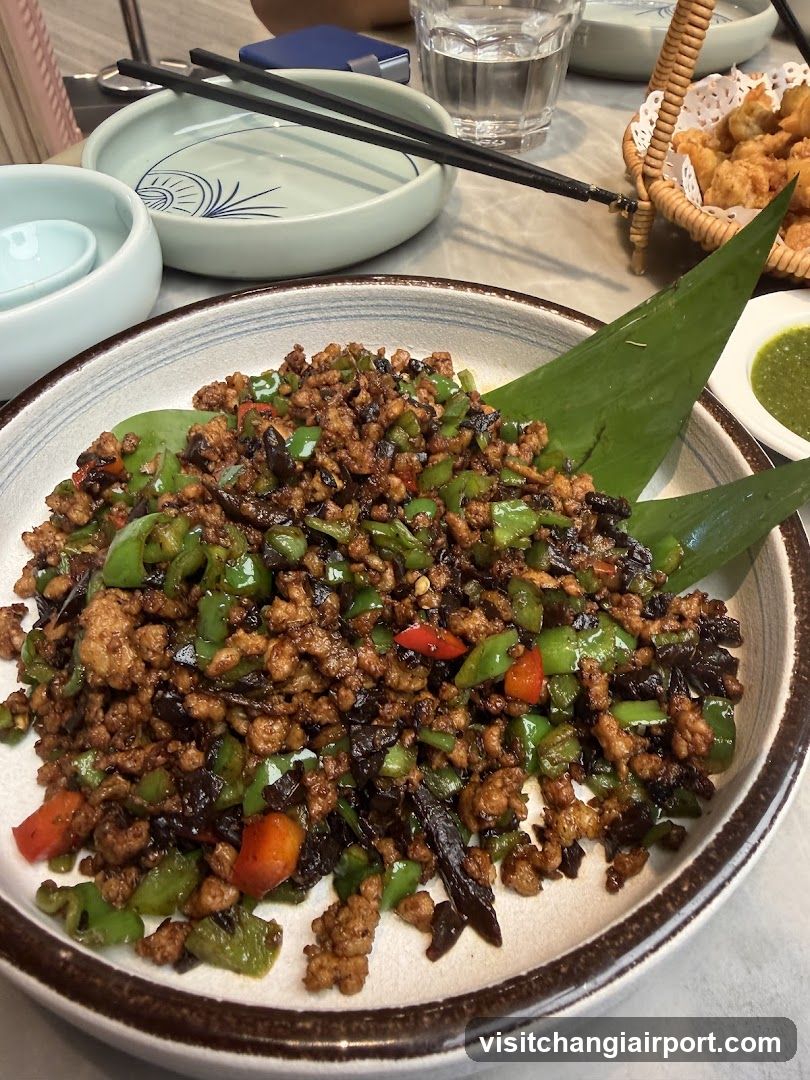 Stir-fried minced meat with peppers and preserved vegetables