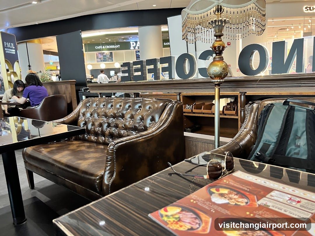 Coffee Shop Interior with Leather Seating and Menu Display