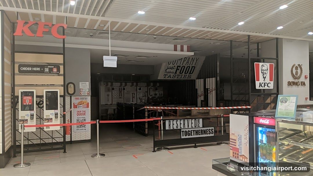 KFC Interior View with Signage and Barriers