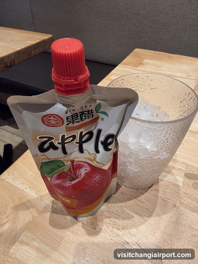 Apple Vinegar Pouch and Glass of Ice Water