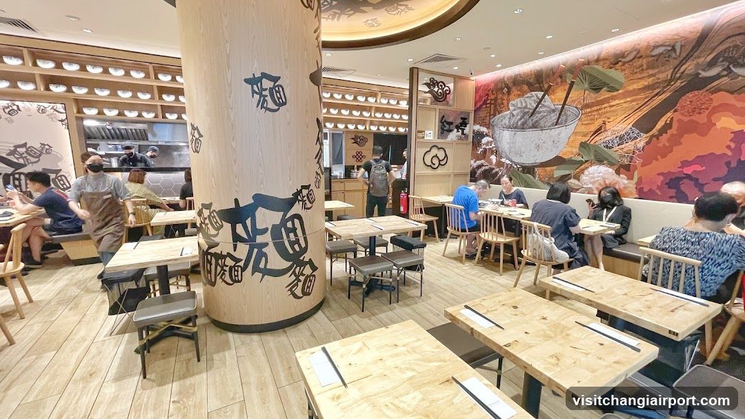 Restaurant Interior with Wooden Tables and Decorative Column