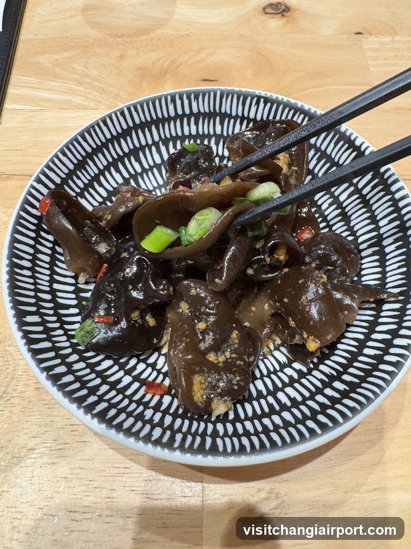 Bowl of black fungus with green onions and chili