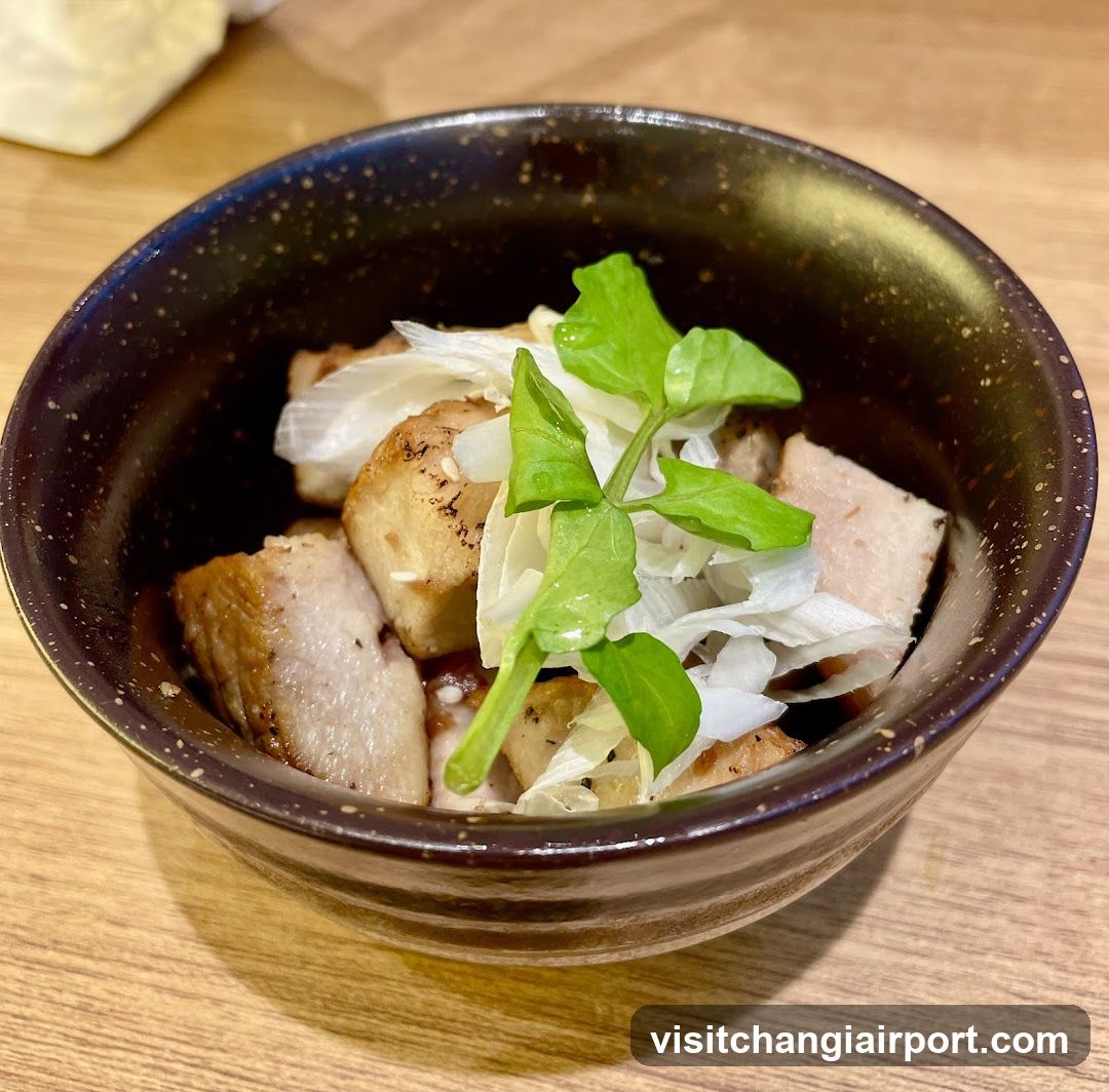 Bowl of Grilled Pork with Greens and Onions
