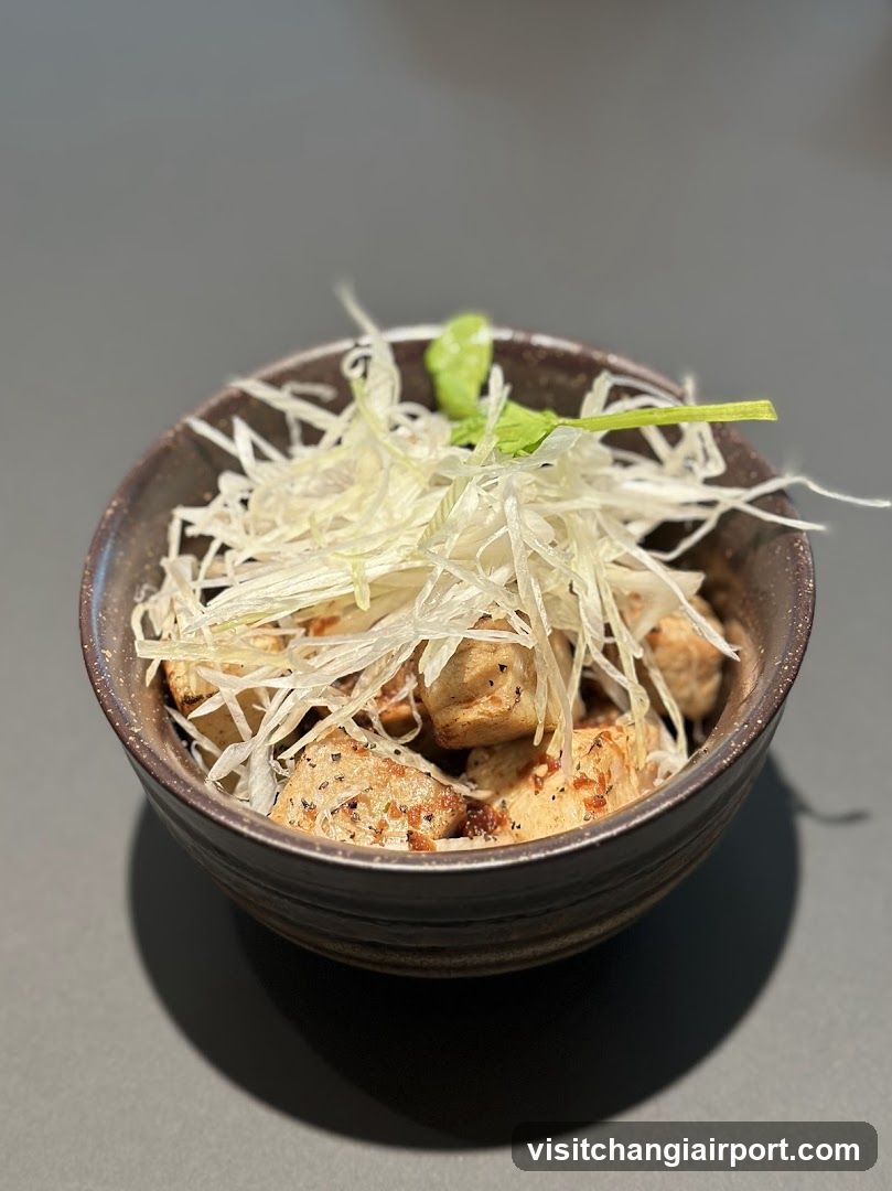 Bowl of food with shredded topping