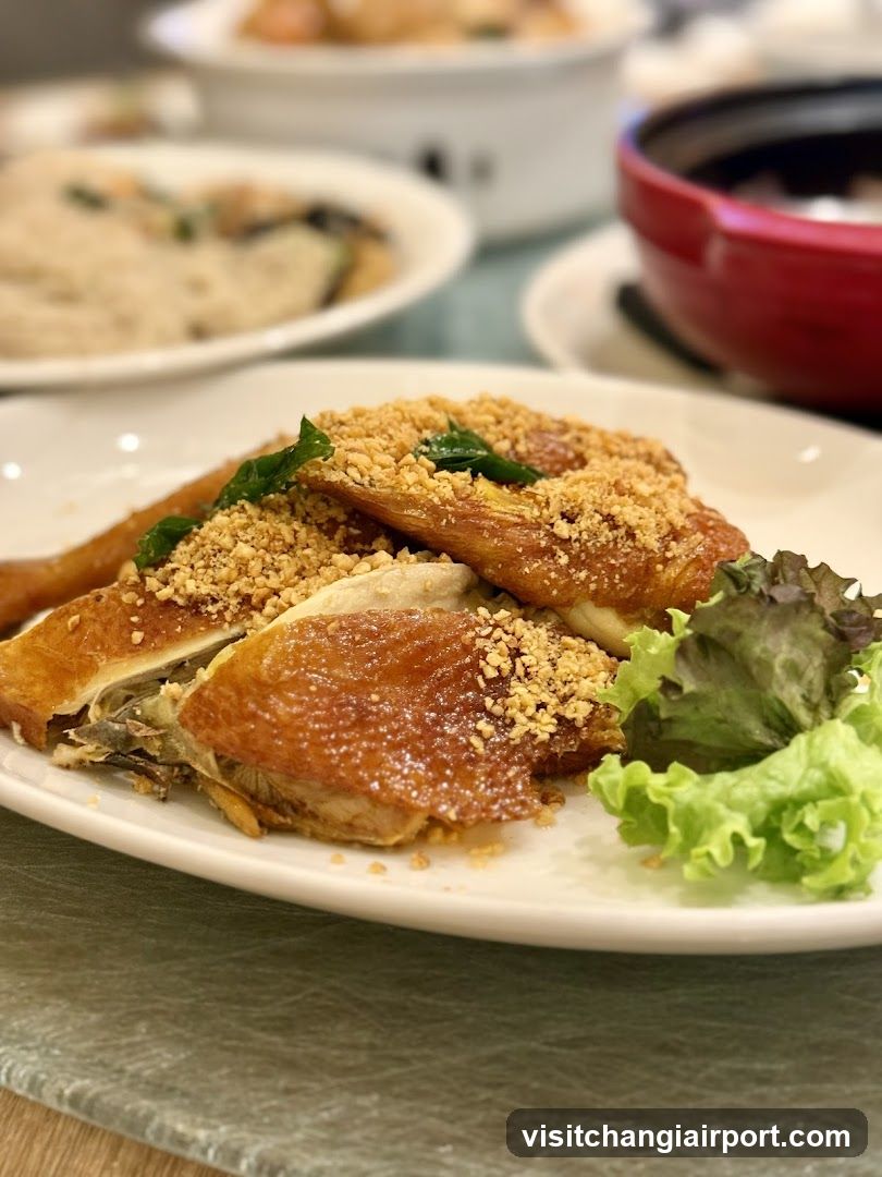 Crispy Chicken Dish with Crumbs and Lettuce Garnish