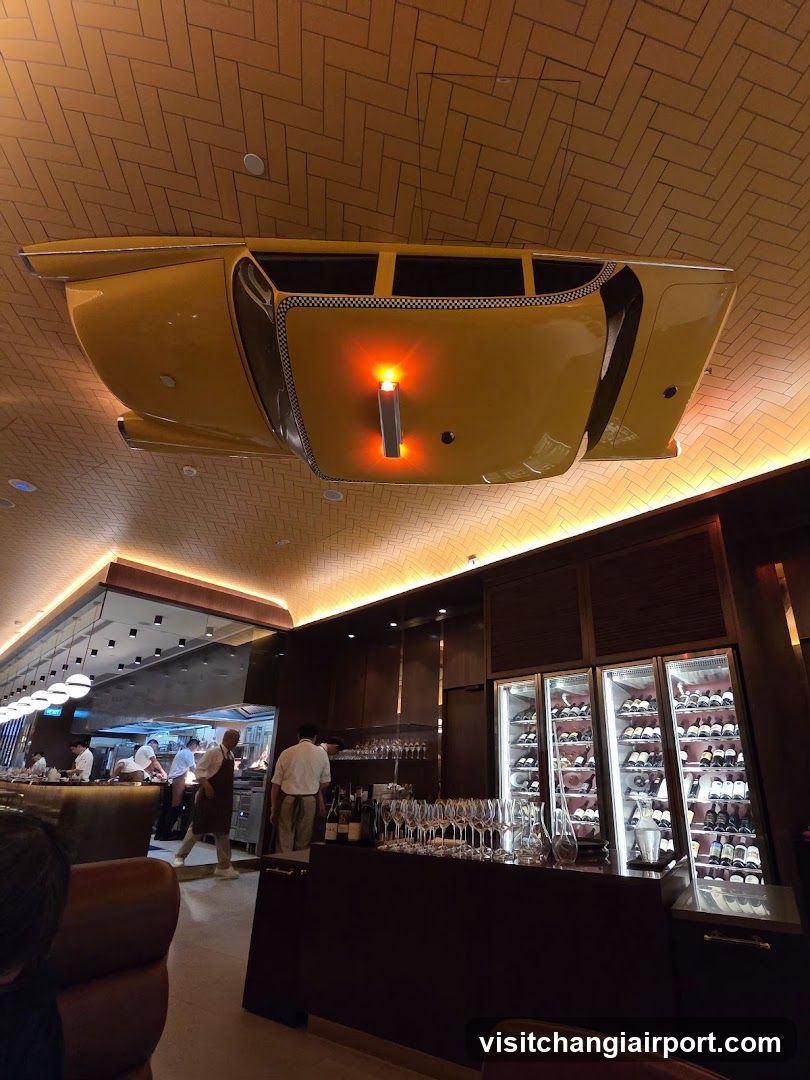 Interior of a modern bar or restaurant with suspended car art