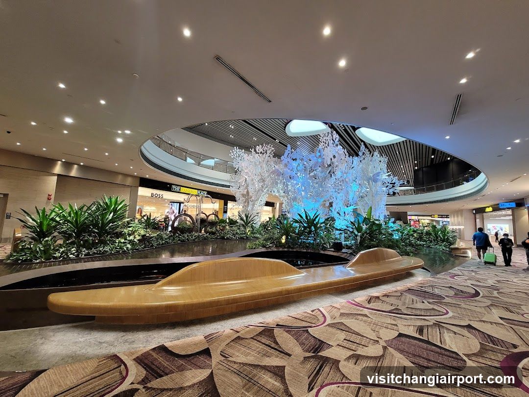 Airport Terminal Interior with Decorative Fountain and Greenery