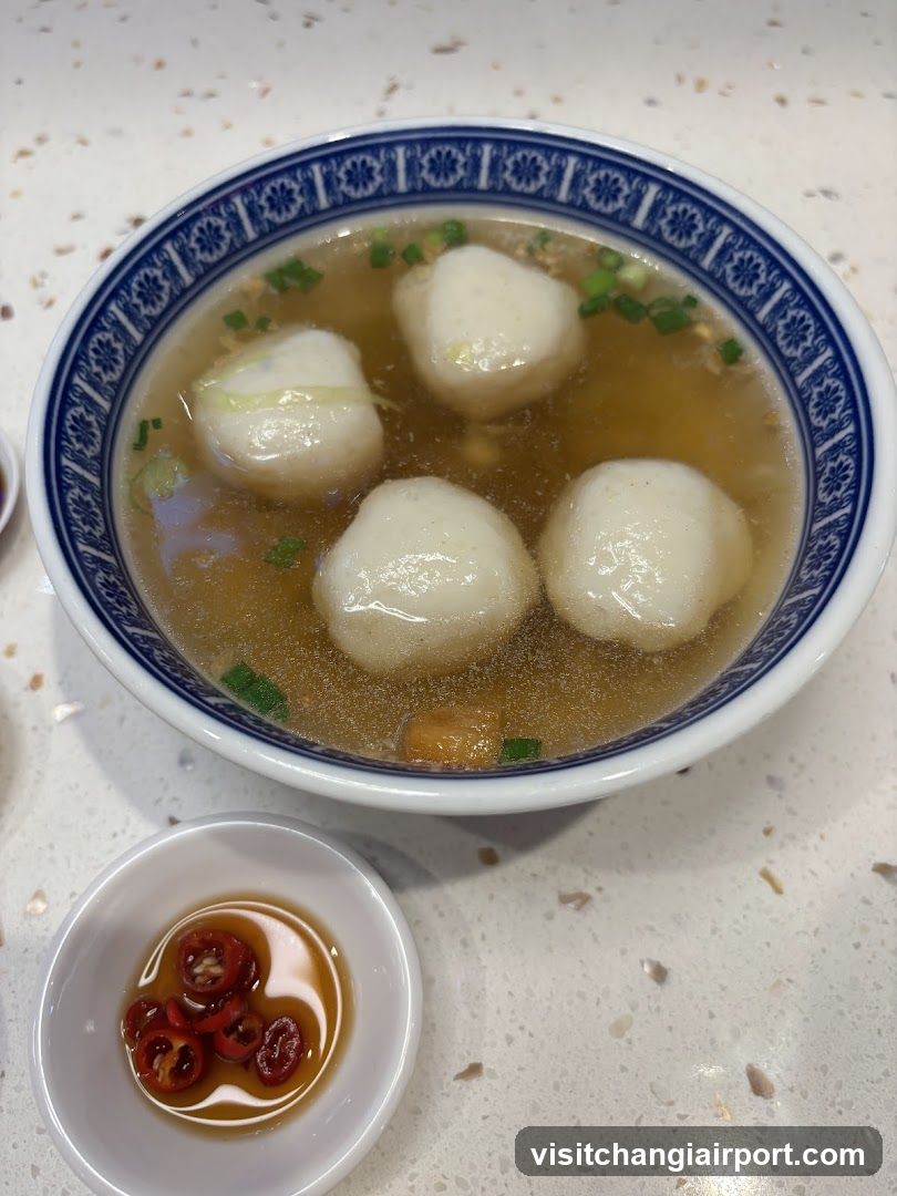 Bowl of Fish Balls Soup with Chili Sauce