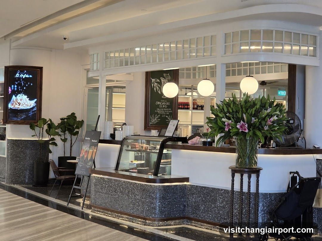 Interior Cafe Counter with Menu Board and Floral Display