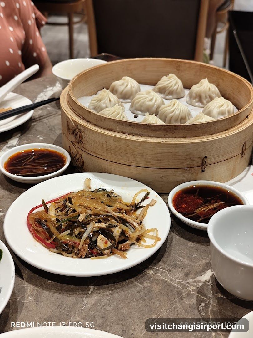 Dining Table with Dumplings and Side Dishes