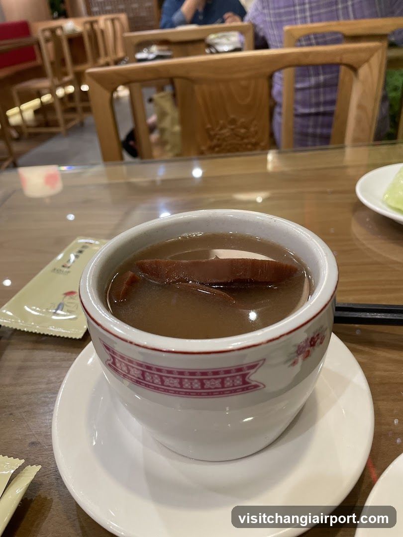 Bowl of Soup with Slices in Restaurant