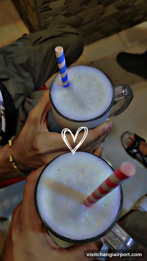Two frothy drinks with straws