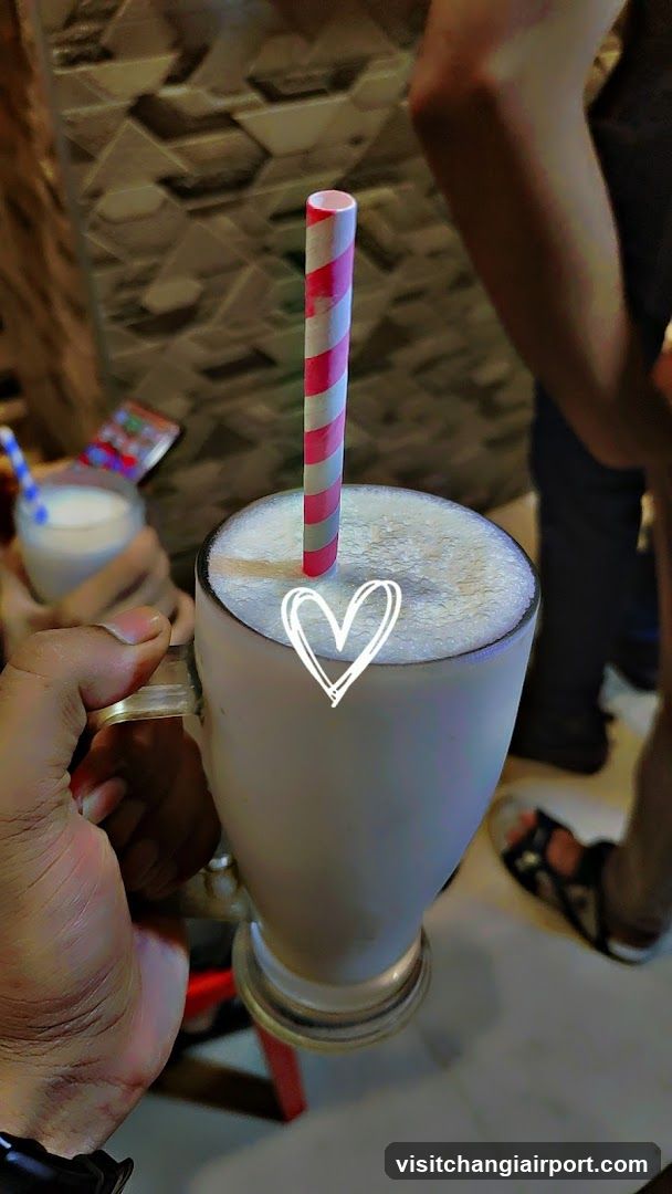 Handheld Milkshake with Striped Straw