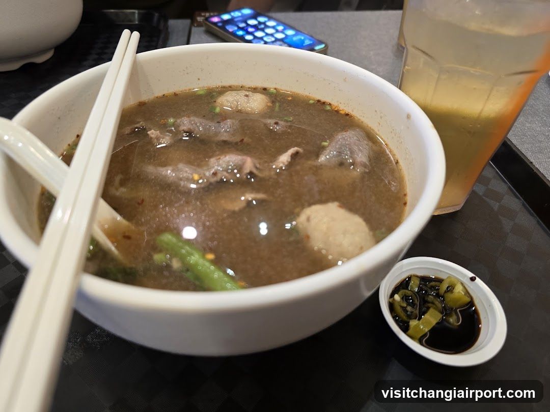 Bowl of Soup with Chopsticks and Drink