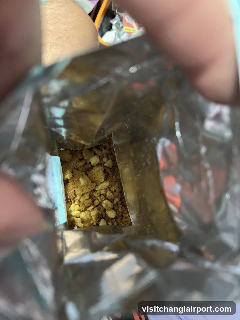 Open snack bag with crumbs