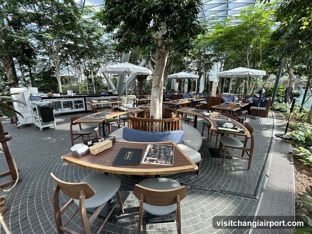 Outdoor Dining Area with Greenery and Seating
