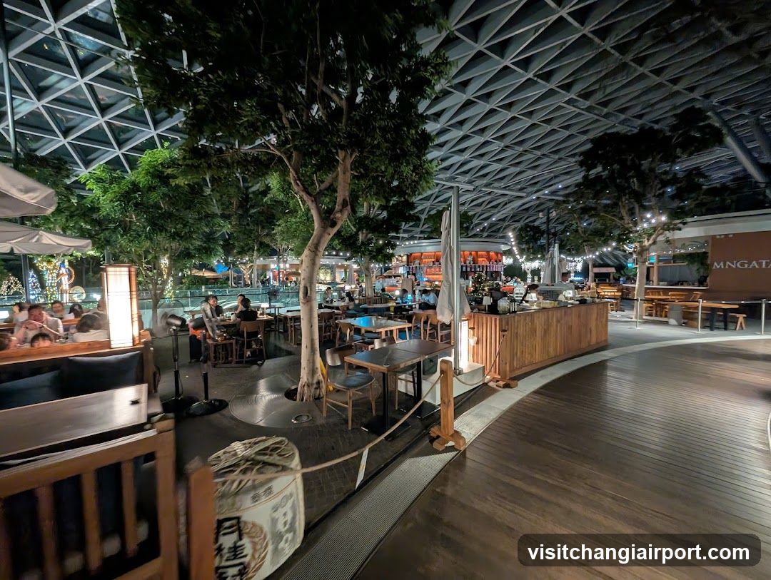 Indoor Dining Area with Trees and Bar